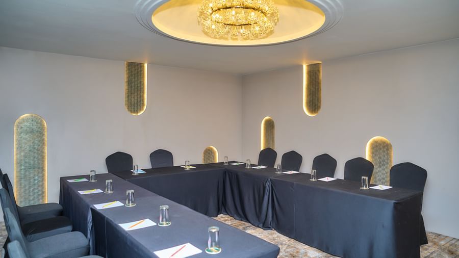 Conference room with U-shaped seating at Voyage Milestone Hotel and Banquet.