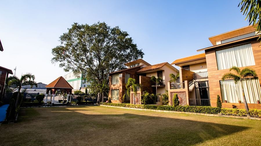 Spacious garden in front of villas at Wedlock Greens Hotel & Resort, Dhanbad