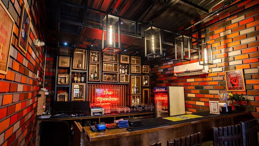 seating arrangements inside a restaurant - Wedlock Greens Hotel Resorts Dhanbad