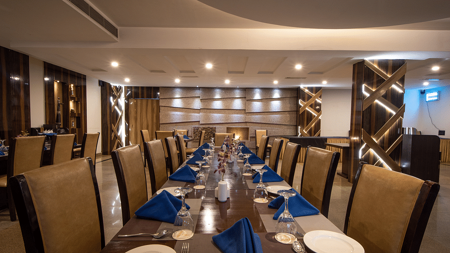 A well-set dining table with neatly arranged plates and cutlery at the Thyme Restaurant