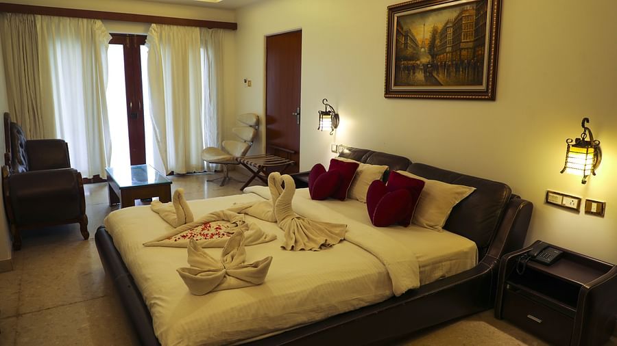 a double bed inside Luxury Villa - White pearl suites by rosetum 