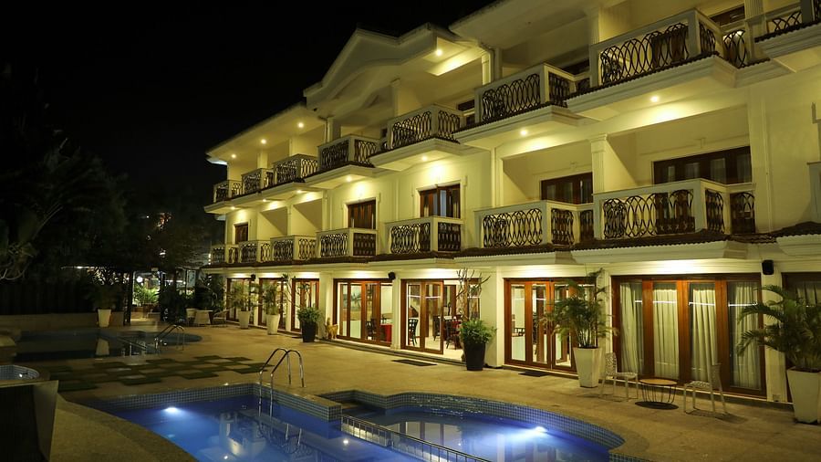 interior view of rooms with swimming pool in the night of White pearl suites by rosetum 