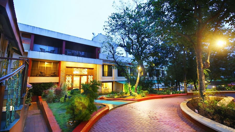view of the outside lawn area of the resort in the evening - Zara's Resort