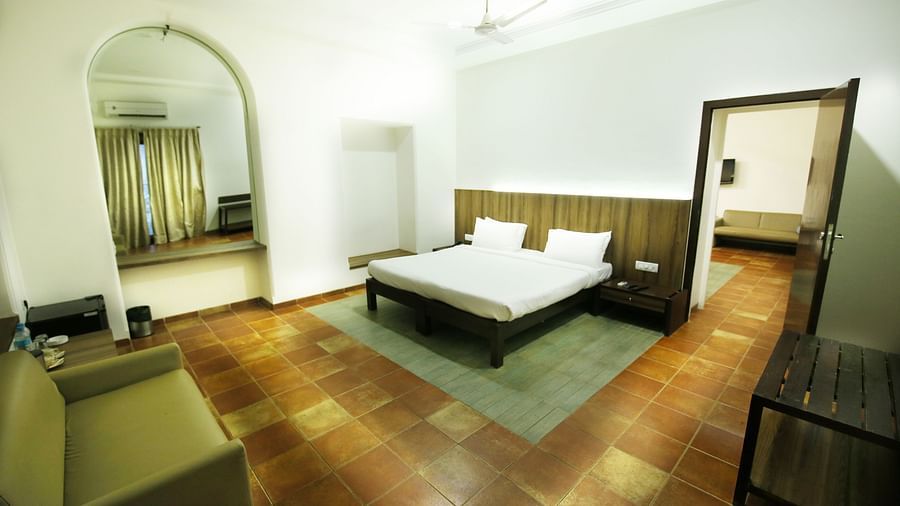 a king size bed at the bedroom overlooking the separate living room - Zara's Resort