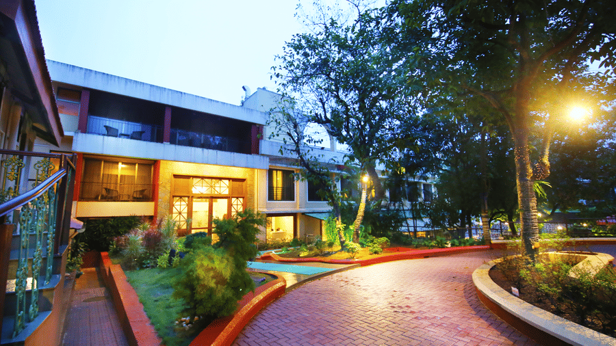 The outside lawn area of Zara's Resort during evening time