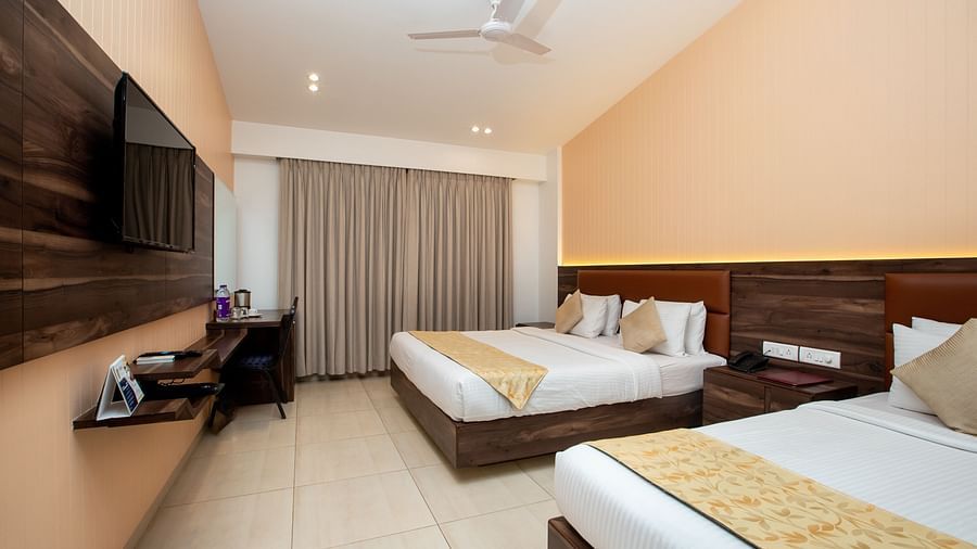 Picture showing the King size bed and the Single bed in the Super Deluxe Triple Suite, at ZARA’s Resort, Khandala