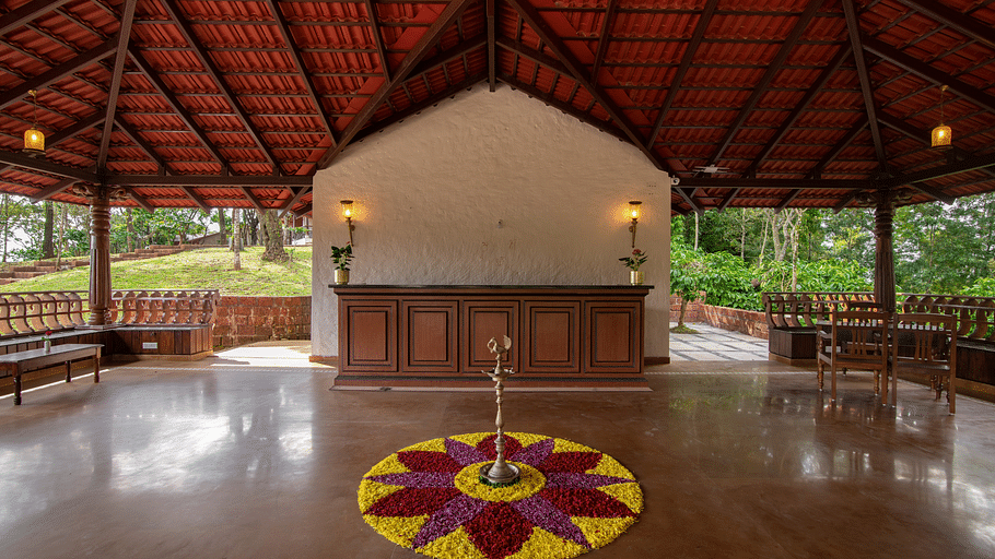 A rangoli done with flower petals in the centre at Navarasa restaurant TGI Tapovana