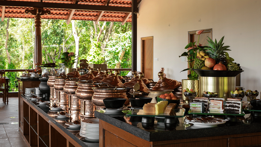 Different containers on a table for buffet at Navarasa restaurant TGI Tapovana