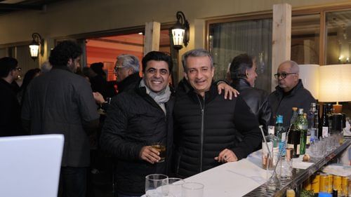 An image of two men smiling for the camera at an event at Heritage Village Resorts & Spa