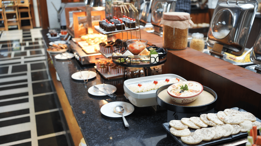 buffet spread featuring various hot and cold dishes in serving containers  at The Golden Tusk, Jim Corbett