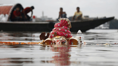 Lord Ganesha Statuette Submerged on Body of Water