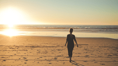person walking on Juhu Beach