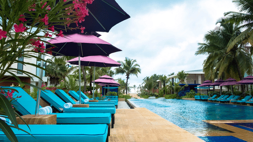 swimming beds lined beside the pool at Azaay Beach Resort