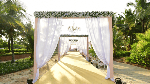 Wedding aisle decorated with flowers for your destination wedding venue in goa