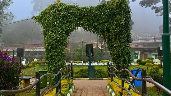 An overview to the entrance to Raja Seat with mist covering in the background
