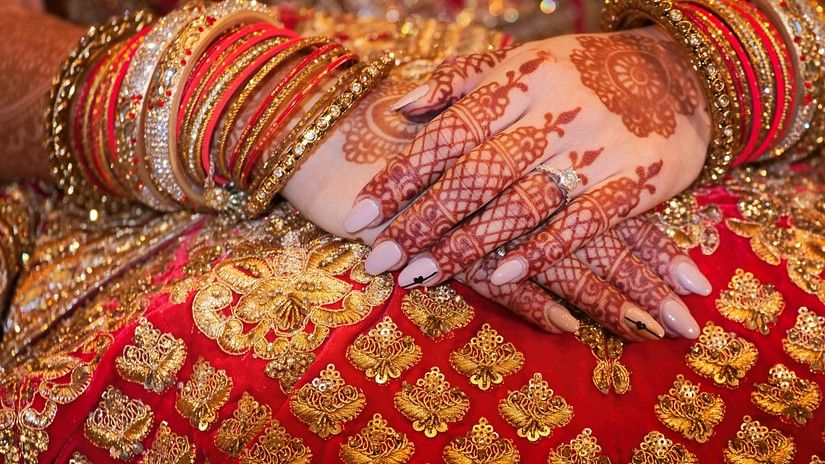 a close up image of a Mehendi on a bride