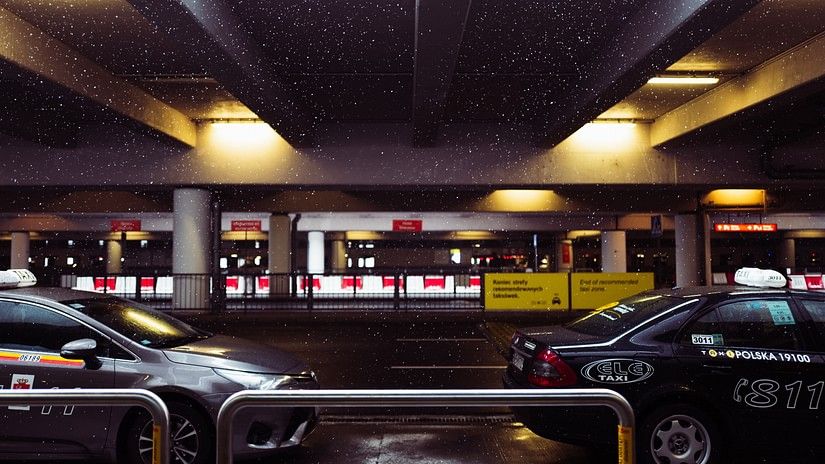 many Cars parked in the parking area with the background blurred