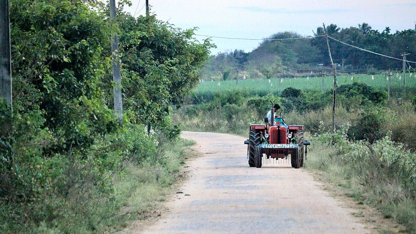 a tractor on a farm road