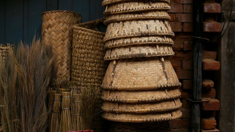 An overview of a weaving shop with many baskets in view among other products.