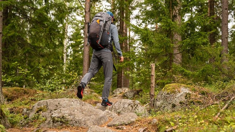 An adventurer treking in a rocky terrain 