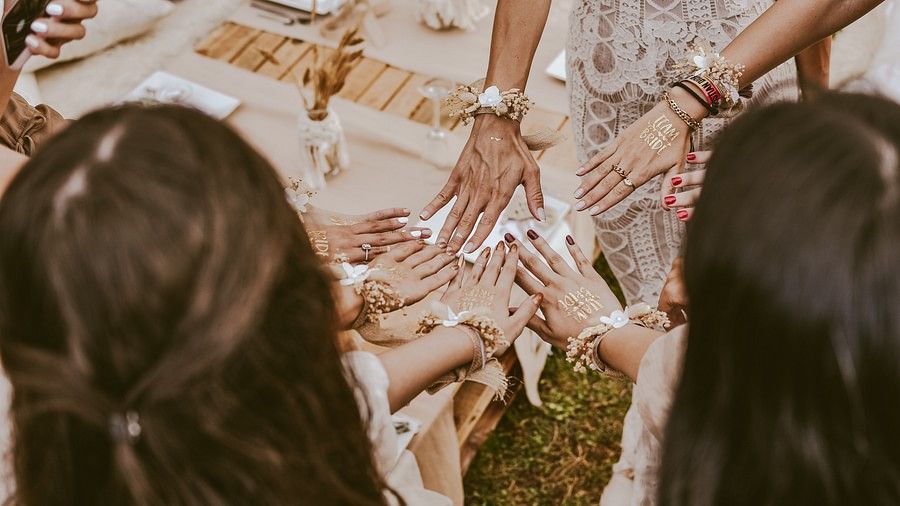 a group of girls showing off their engagement rings and celebrating a bachelorette party in Goa