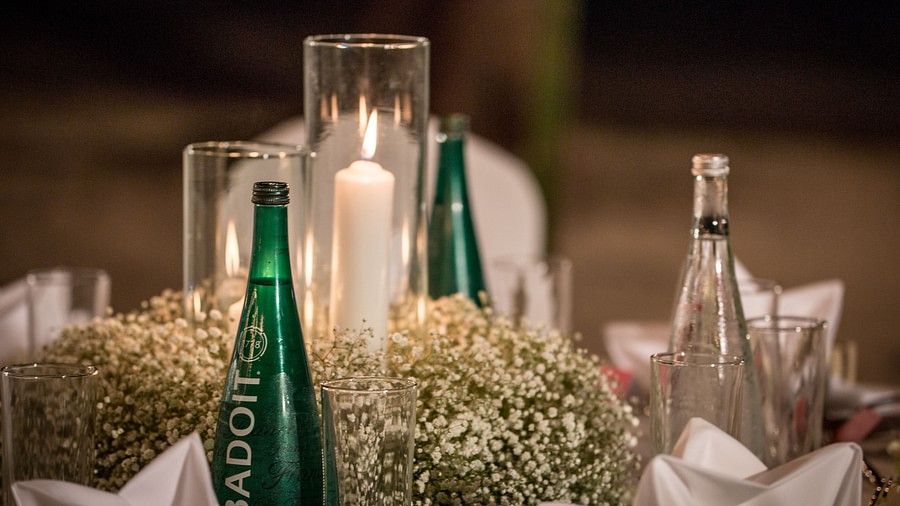 close up image of the dining table decorated with candle and flowers - Maikhao Dream Villa Resort & Spa, Phuket