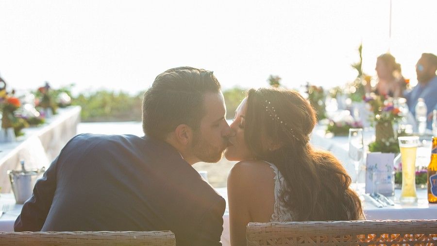 image of the couple sharing a kiss with a bright sunlight in the background - Maikhao Dream Villa Resort & Spa, Phuket