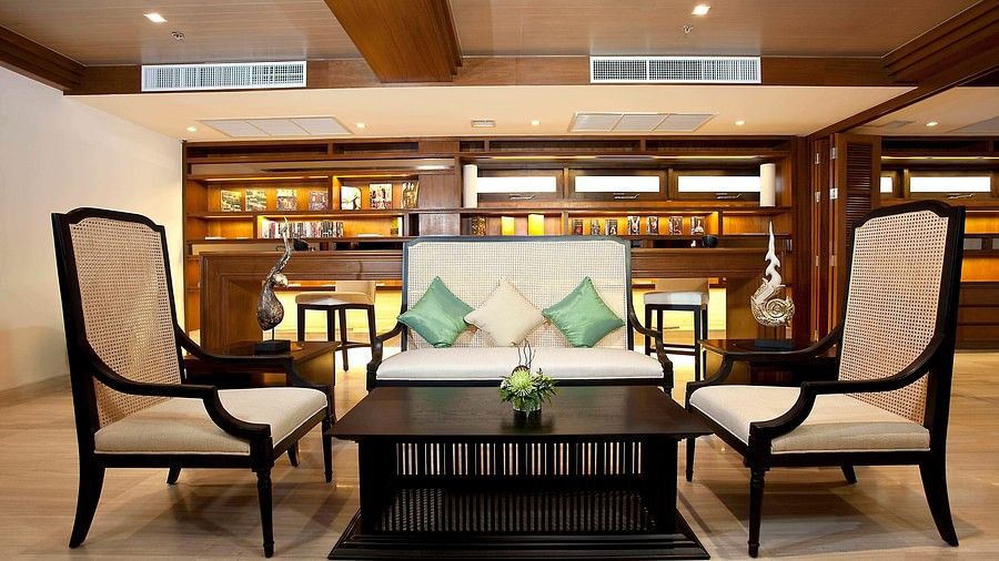 image of a common seating area with an expansive library in the background - Maikhao Dream Villa Resort & Spa, Phuket