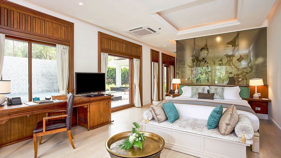 image of a bedroom with a king size bed along with a couch - three bedroom private pool villa