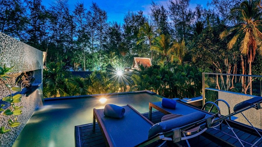 image of an outdoor seating area with two sun loungers in front of a mini pool - three bedroom private pool villa