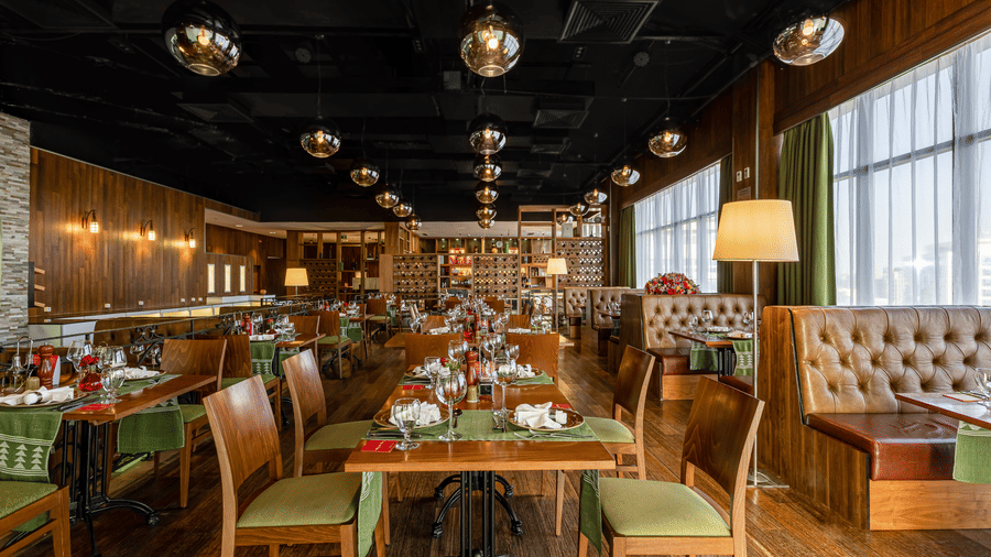 An overview of the many tables and chairs inside FOGO NO CHÃO restaurant - Ramada by Wyndham Addis, Addis Ababa