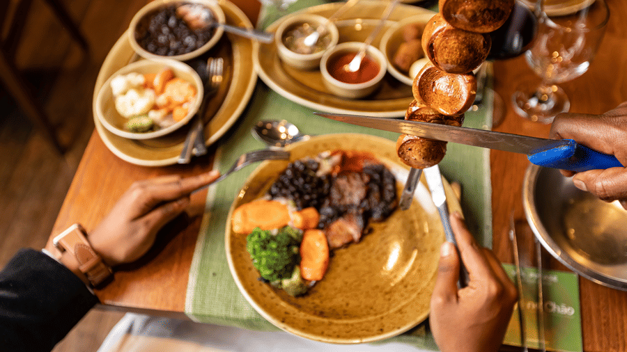 A POV of a guest sitting on the table of the many items placed on a table inside the restaurant - Ramada by Wyndham Addis, Addis Ababa.