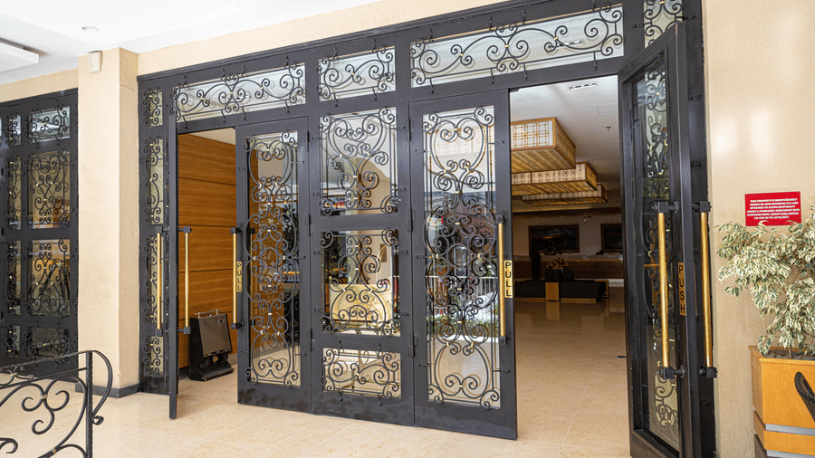 An overview of a beautifully made metal and glass door inside Ramada by Wyndham Addis, Addis Ababa.