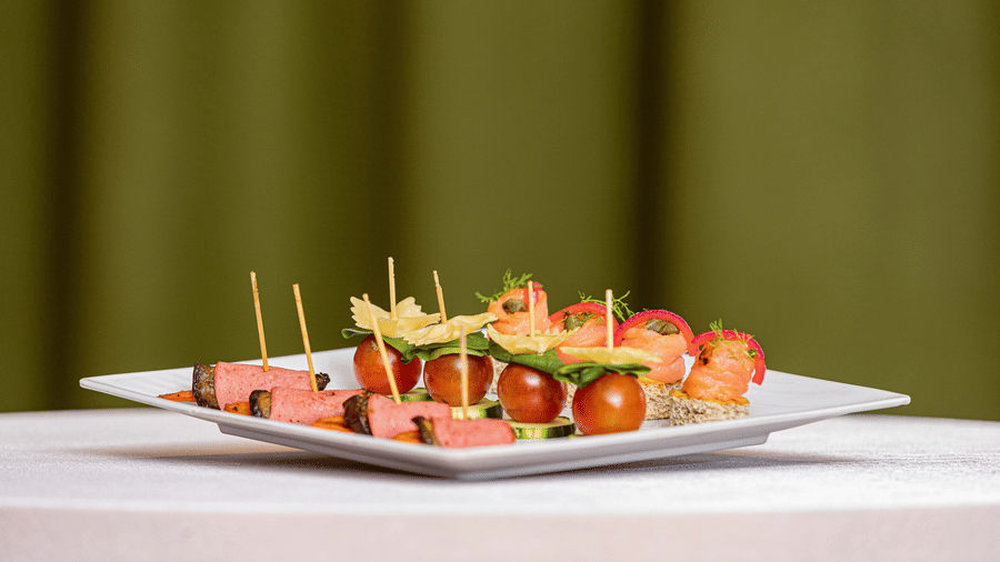 A close up of different starters kept on a plate that is placed on a table - Ramada by Wyndham Addis, Addis Ababa.