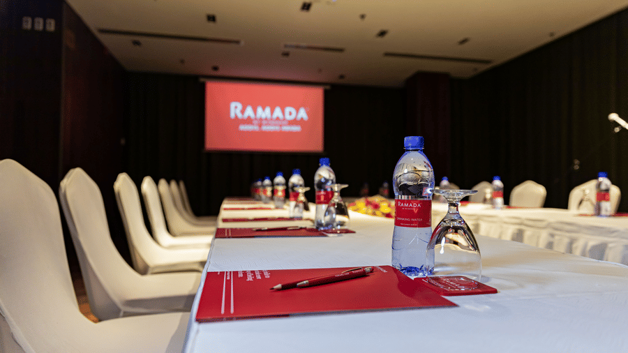A close up shot of a meeting room with a projector in the background - Ramada by Wyndham Addis, Addis Ababa.
