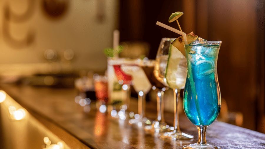 A close up shot of many cocktail drinks kept on a bar table inside FOGO NO CHÃO - Ramada by Wyndham Addis, Addis Ababa