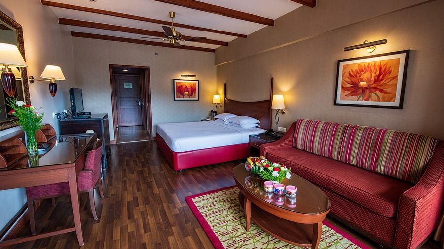 a room with sofa and a bed