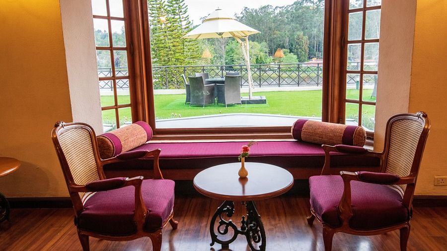 the sitting area overlooking the lawn at The Hearth, the coffee shop in Kodaikanal