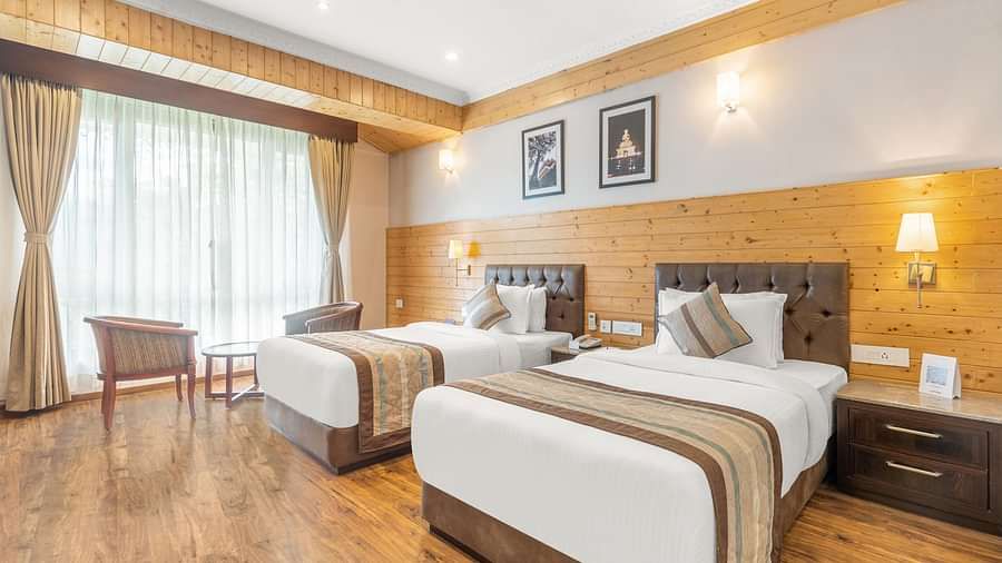A room at Summit Alpine Abode with twin beds and French windows