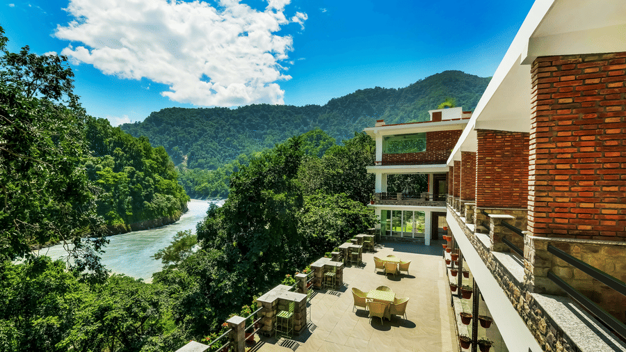 Facade of Summit By The Ganges Beach Resort & Spa, Rishikesh with view of the lush greenery at Summit By The Ganges Beach Resort & Spa, Rishikesh