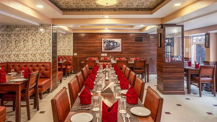 Multiple dining tables and chairs placed in a closed hall | Summit Oakden Resort & Spa, Mall Road