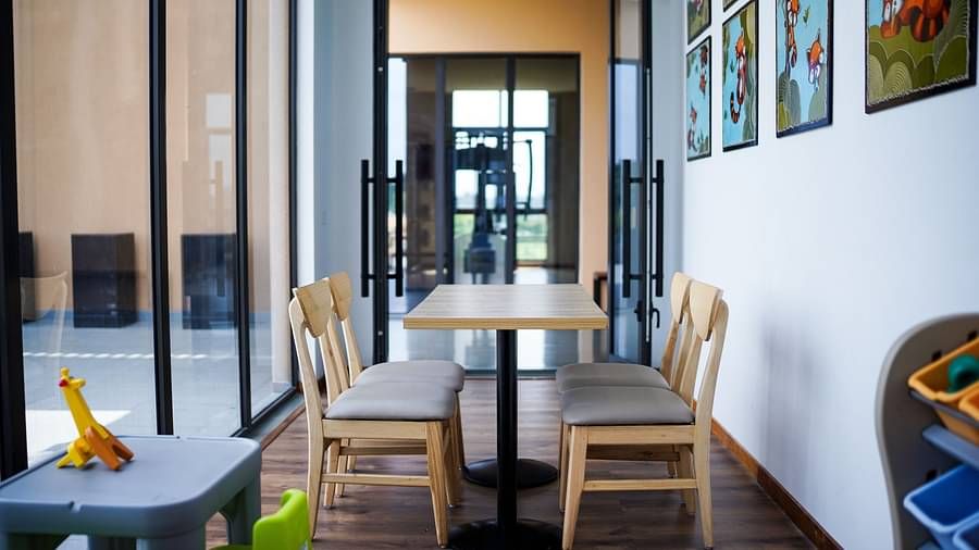 Kids play area at Singalila Club with large French windows letting in light during the day