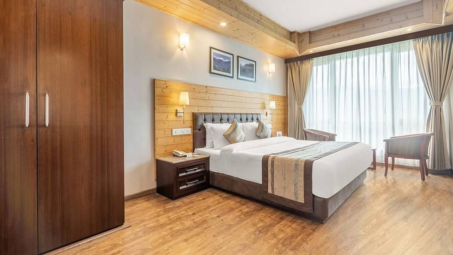 A room at Summit Alpine Abode with a double bed and a wardrobe