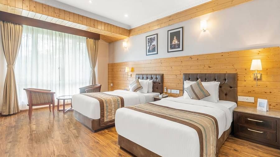 A room at Summit Alpine Abode with twin beds and French windows