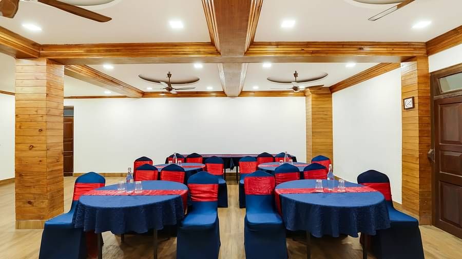Seating arrangement in the banquet hall at Summit Barsana Resort & Spa, Kalimpong