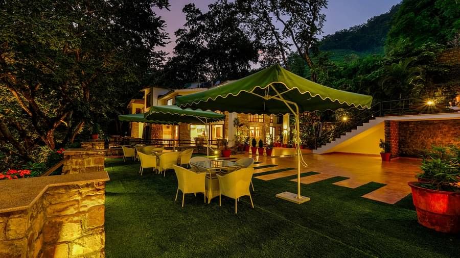 Night viuew of the seating area with shades  at Summit By The Ganges Beach Resort & Spa, Rishikesh