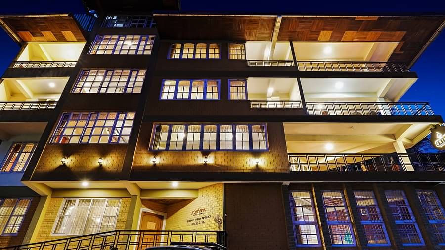 A low-high angle of a well-lit facade of Summit Newa Regency & Spa, Pelling