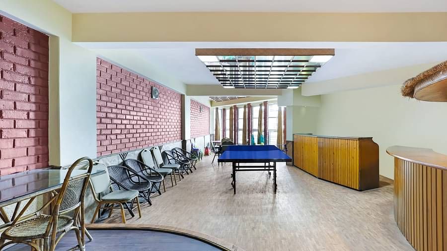 A full view of lobby that has chairs and a TT table placed in the centre | Summit Newa Regency & Spa, Pelling