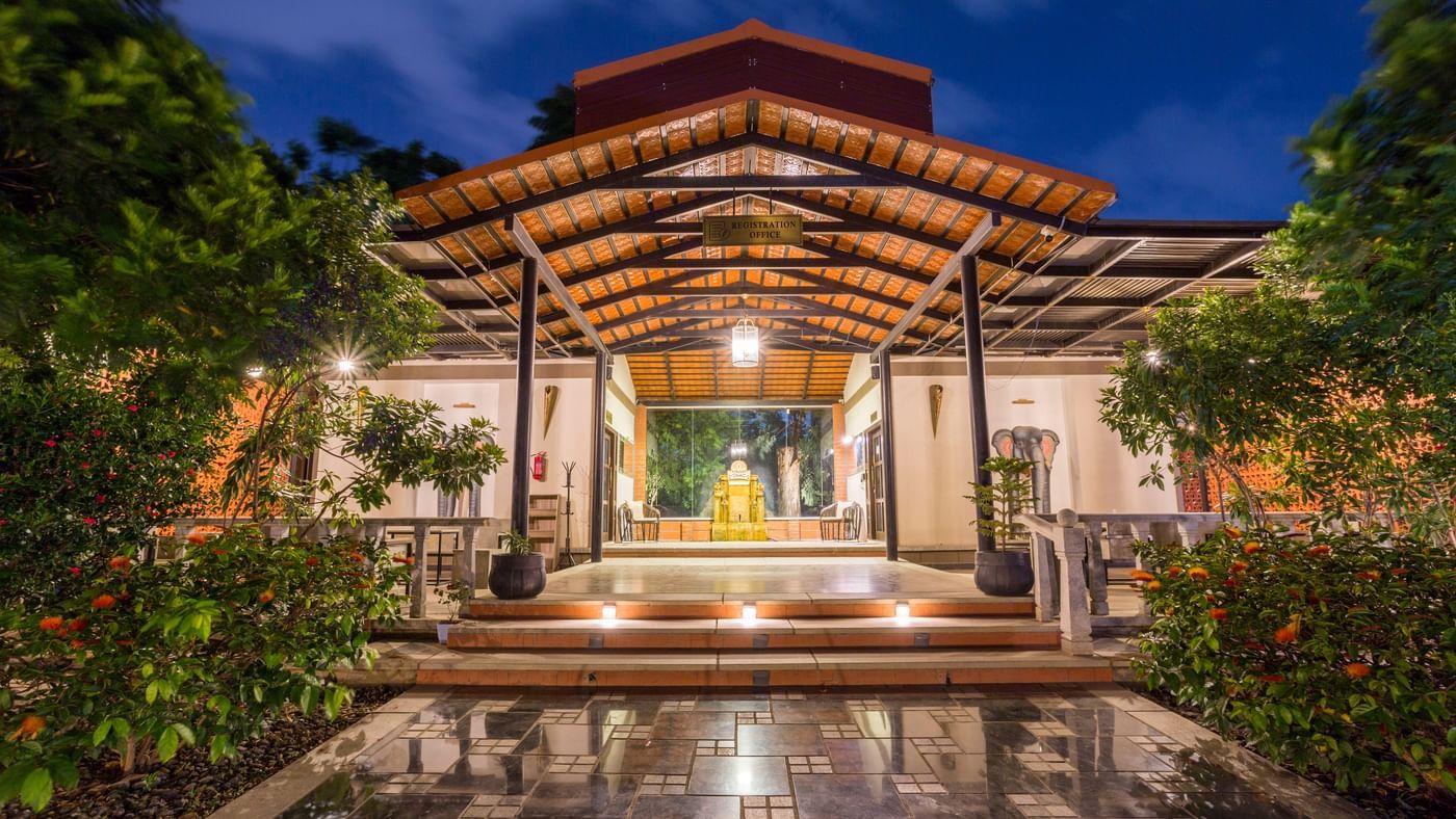 Grand entrance of Nirantara Resort beautifully lit with evening ambiance.