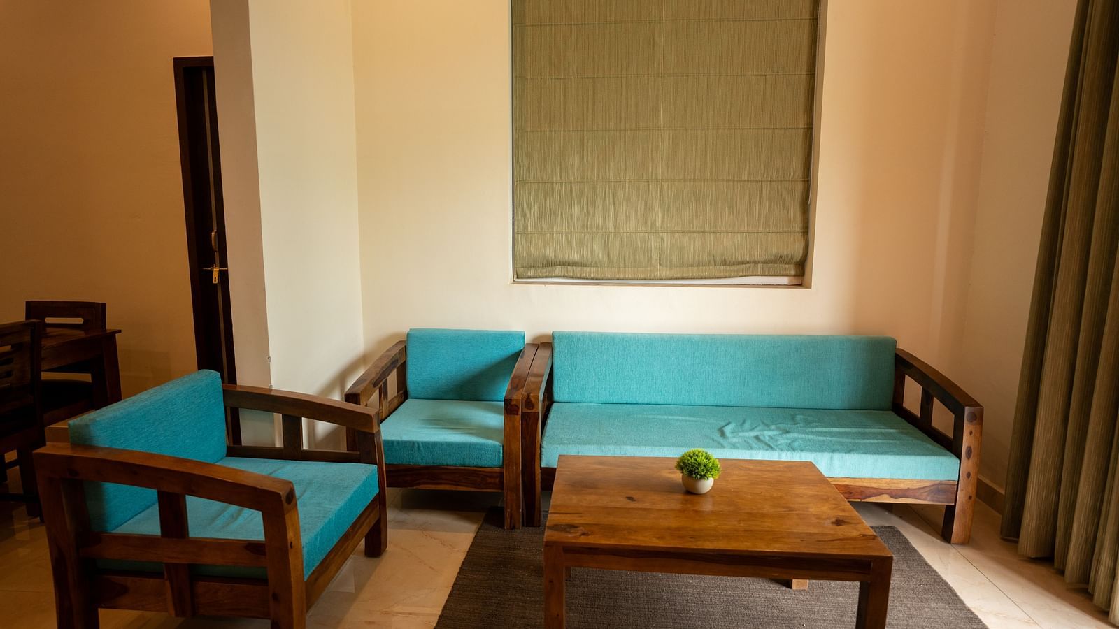 Image of a seating area with sofas and a coffee table at Aanandam Resort & Spa, Pushkar.